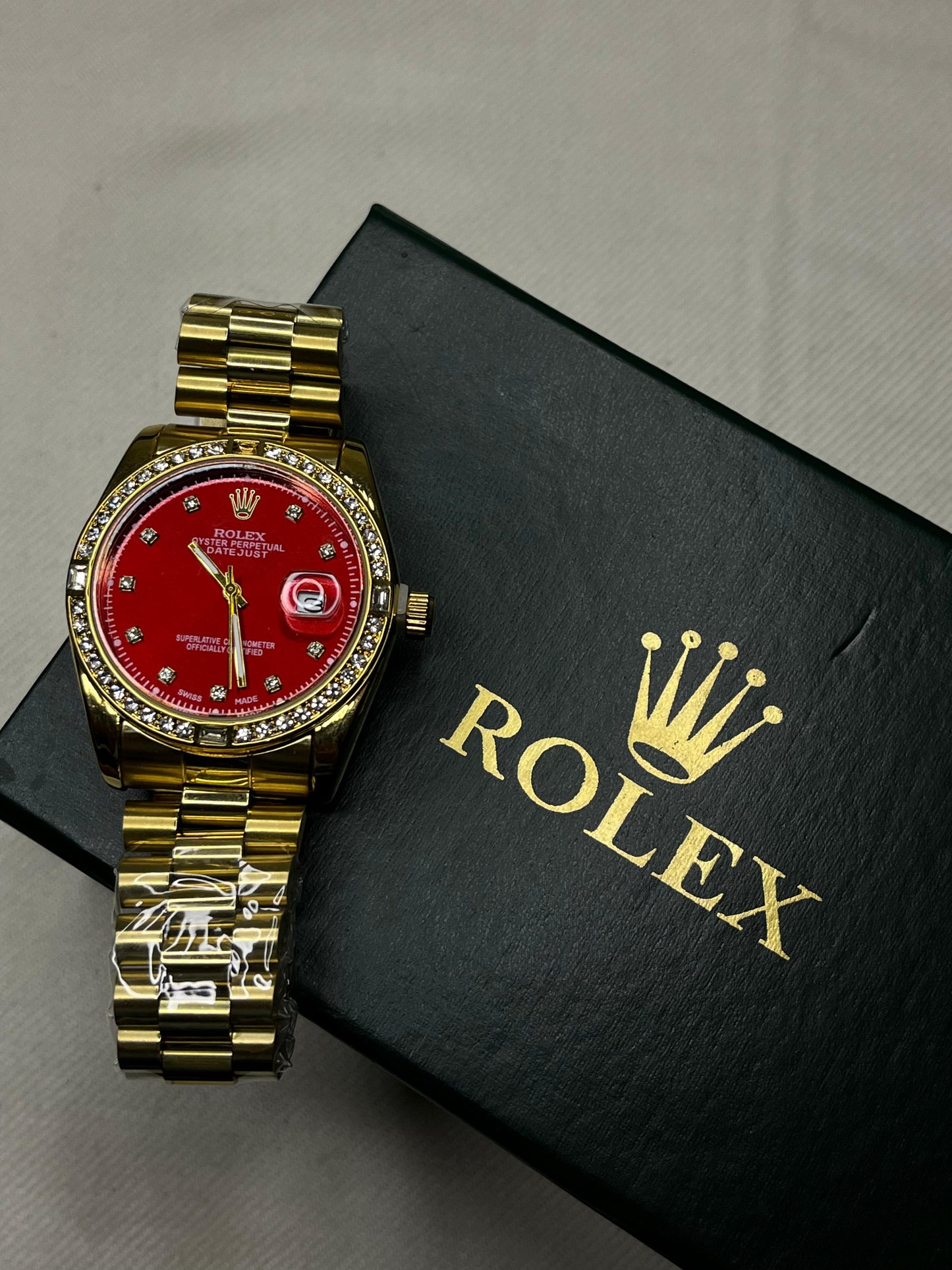 Gold Rolex with Red Dial & Diamonds